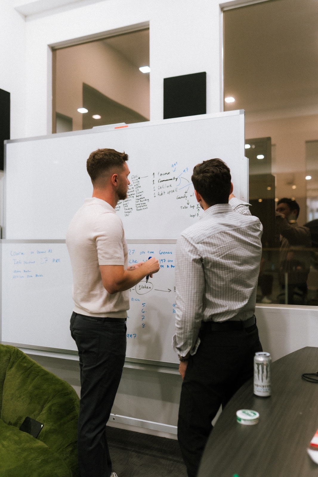 Dawson Gant at a whiteboard mapping telehealth operations and business infrastructure